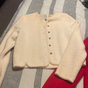 Cute Laura Jean sweater jacket. One cream and one red.
